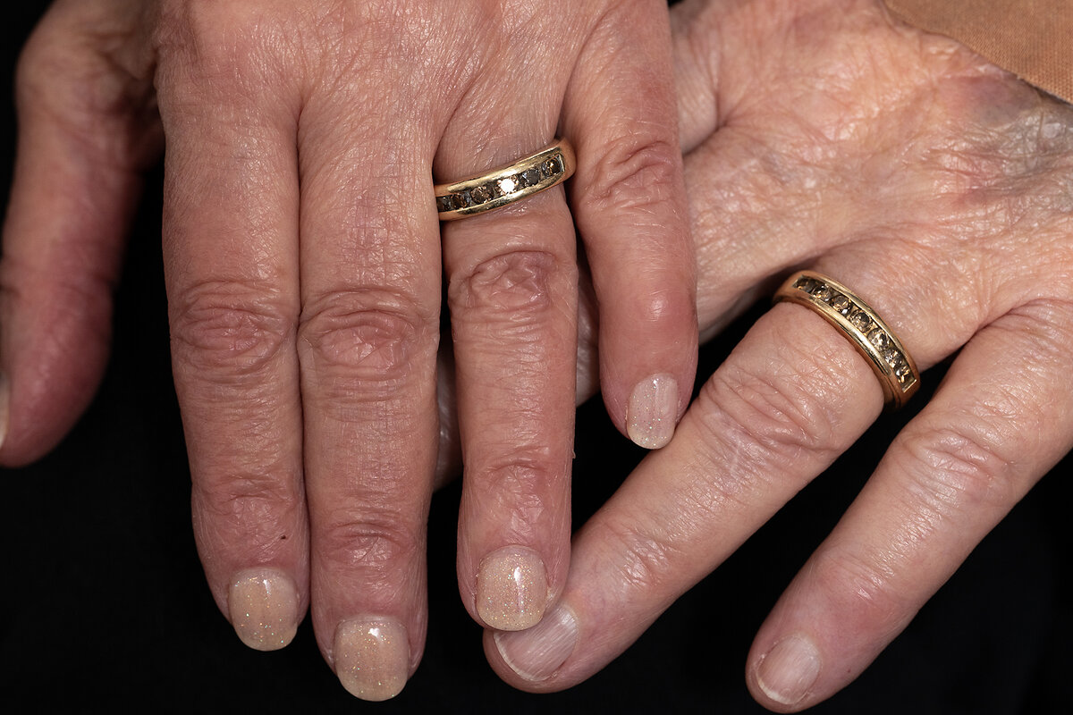 Carole Smith and Marj McCann show off their matching wedding bands in this portrait of their hands.